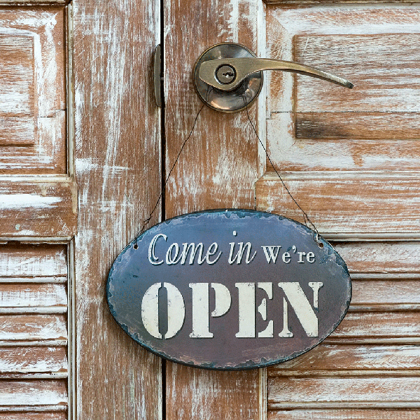 Come in we are open sign on door
