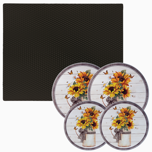 Black counter mat and four Garden Harvest licensed design burner covers on plain background