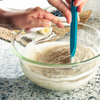 Taste of Home Spatula in Sea Green, mixing batter in bowl 