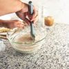 Taste of Home Spatula in Ash Gray, mixing batter in bowl 
