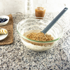 Taste of Home Spatula in Ash Gray, mixing batter in bowl with granola 