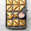 Pizza pockets on baking sheet